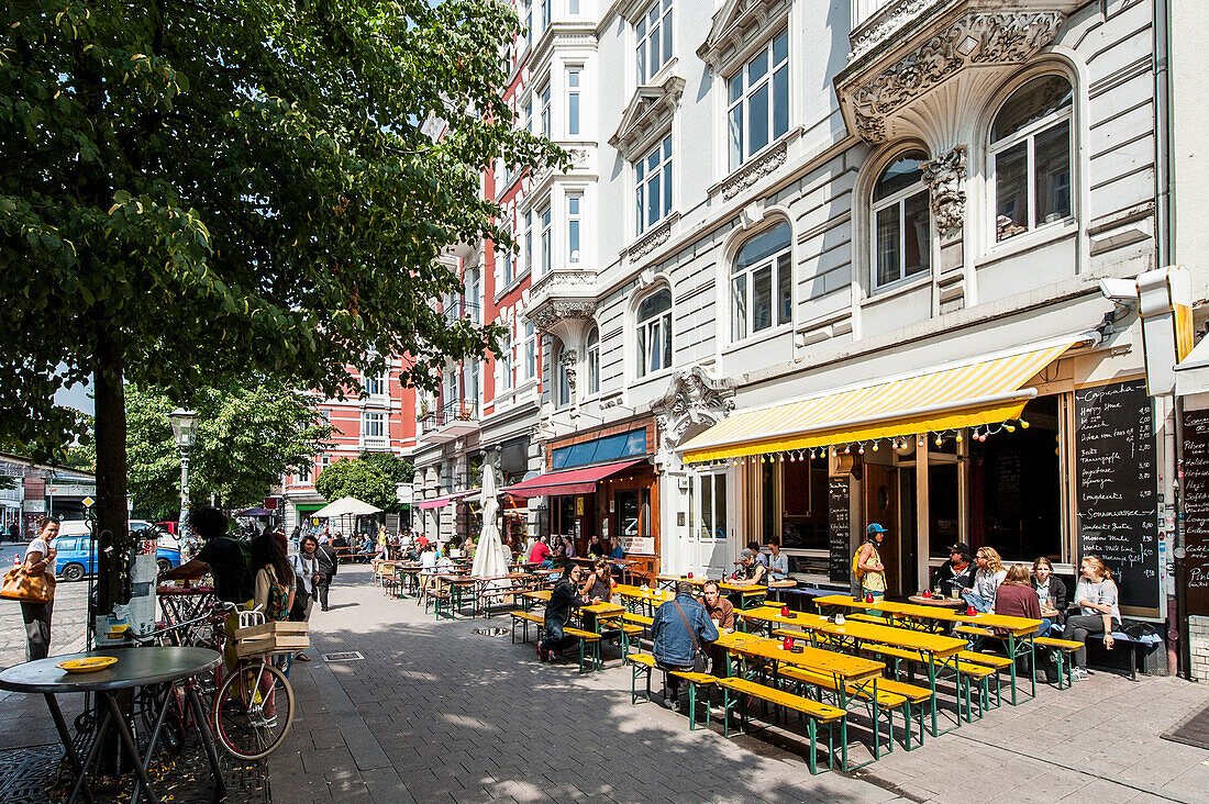 People sitting in street cafes in Hamburg Schanzenviertel, Hamburg, Germany
