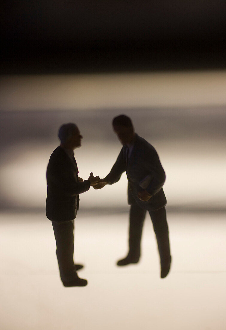 Businessmen Figurines Shaking Hands