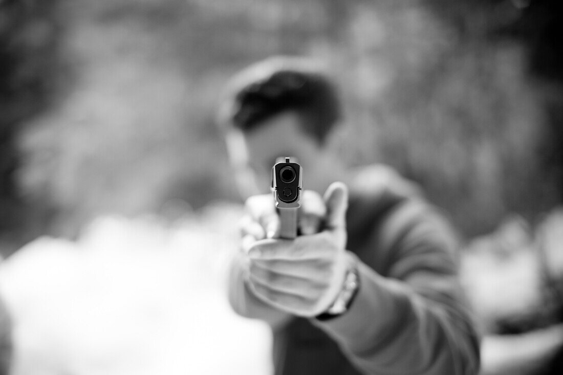 Man Aiming Handgun, Front View