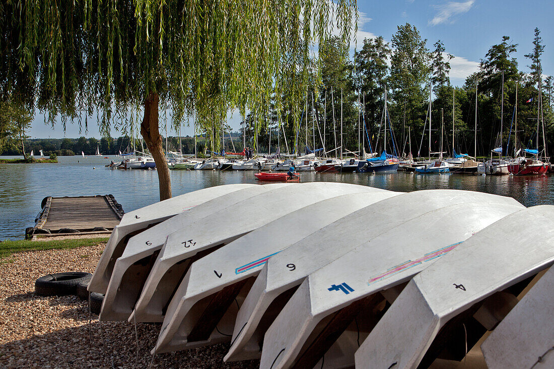 Hulls Of The 'Optimist' Boats Lined Up On The Port At The Nautical Center, The Lake In Mezieres-Ecluizelles, Eure-Et-Loir (28), France