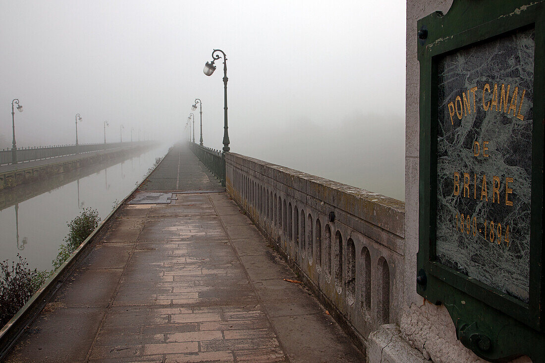 The Atmosphere Of The Briare Bridge-Canal Or Aqueduct In The Morning Fog, Loiret (45), France