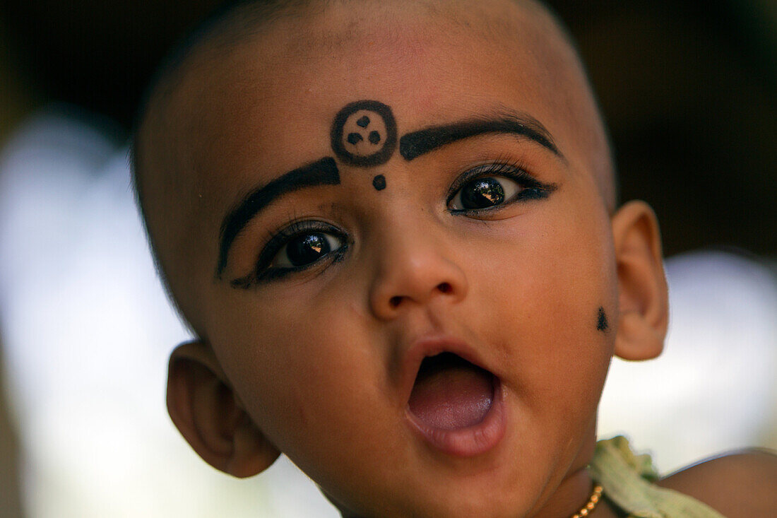 A Child Wearing Kajal Make-Up, A Natural Black-Coloured Balm, Both Make-Up And Eye Care, Nedungolam, Kerala, Southern India