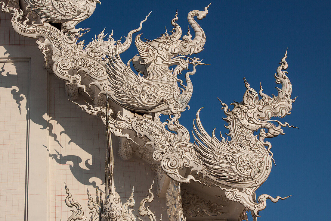 Dragons Adorning The Roof Of The White Temple Or Wat Rong Khun, Temple Built By The Thai Painter Chalermchai Kositpipat Who Wanted To Create A Lasting Tribute To Rama 1X, Region Of Chiang Rai, Thailand, Asia