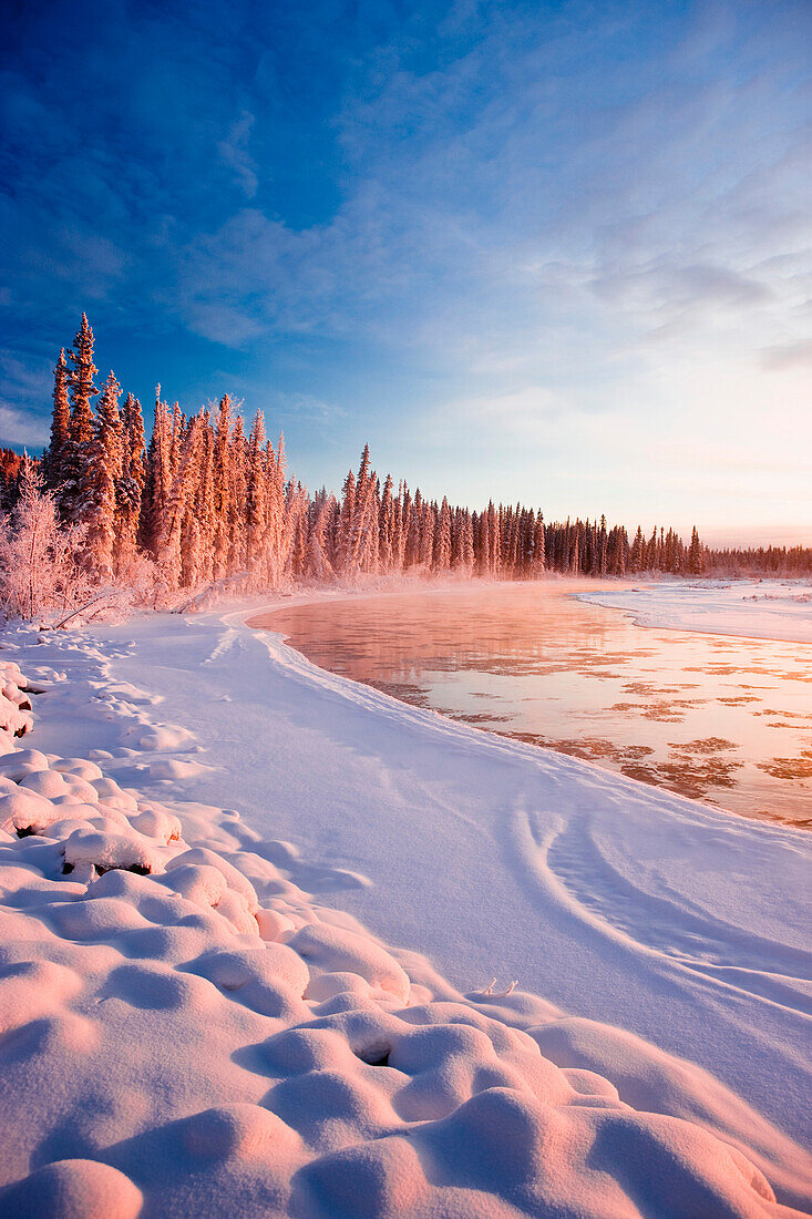 Frosted Spruce Trees And Fog Rising Over The Tanana River Near Richardson Highway In Interior Alaska During Winter