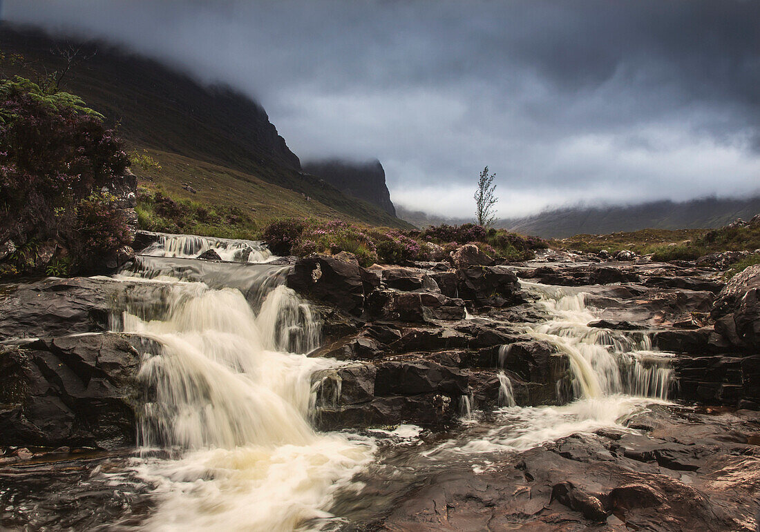 'Water Cascading Over Rocks Under Storm Clouds; Applecross Peninsula Scotland'