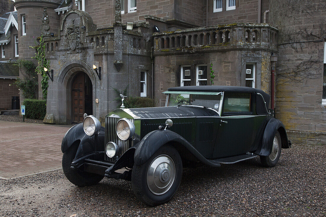 'Vintage Black Car Parked Outside A Large Home; Perthshire Scotland'