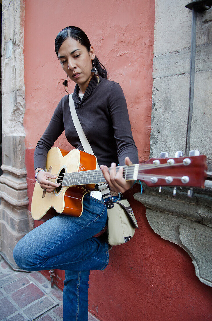 'Mexico, Guanajuato, Female Musician Playing Acoustic Guitar; Guanajuato'