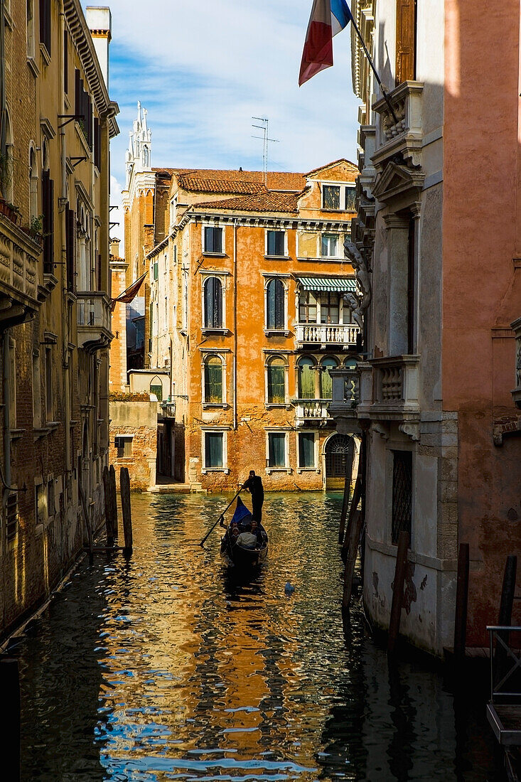 'Italy, Rowing Gondola Through Canal; Venice'