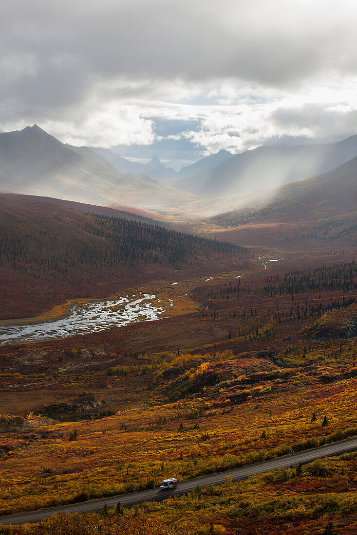 'A Recreational Vehicle Drives On Dempster Highway Past Klondike Valley In Tombstone Territorial Park;Yukon Canada'
