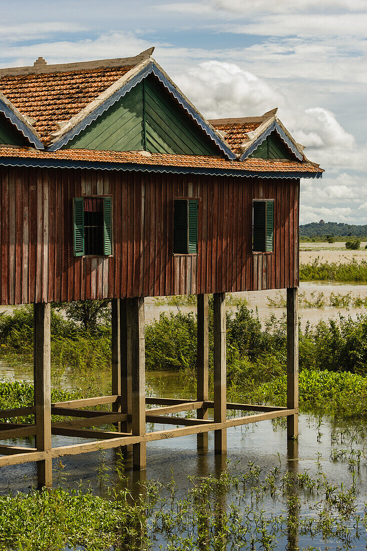 'House On Stilts With Water Below; Cambodia'