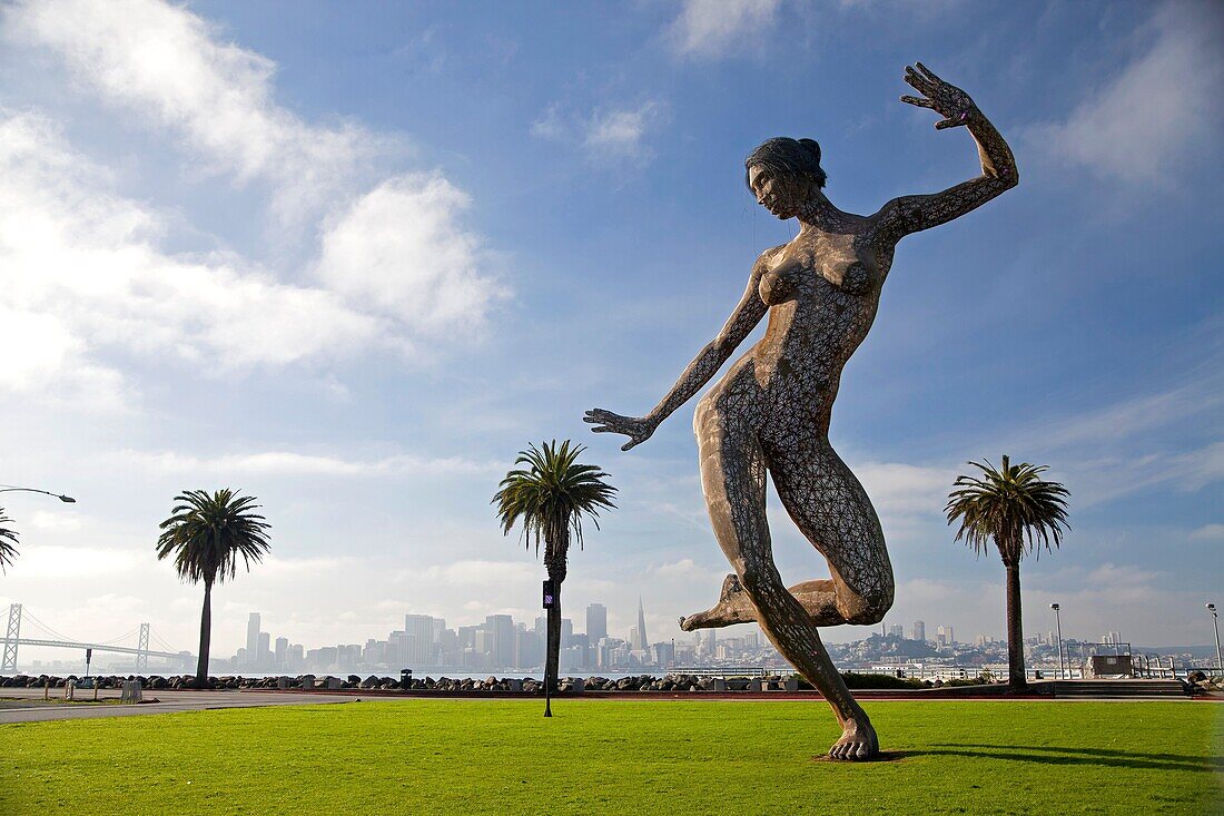 Bliss Dance, a 40-foot statue of a naked dancing woman by sculptor Marco Cochrane on Treasure Island, San Francisco, California, United States of America, USA
