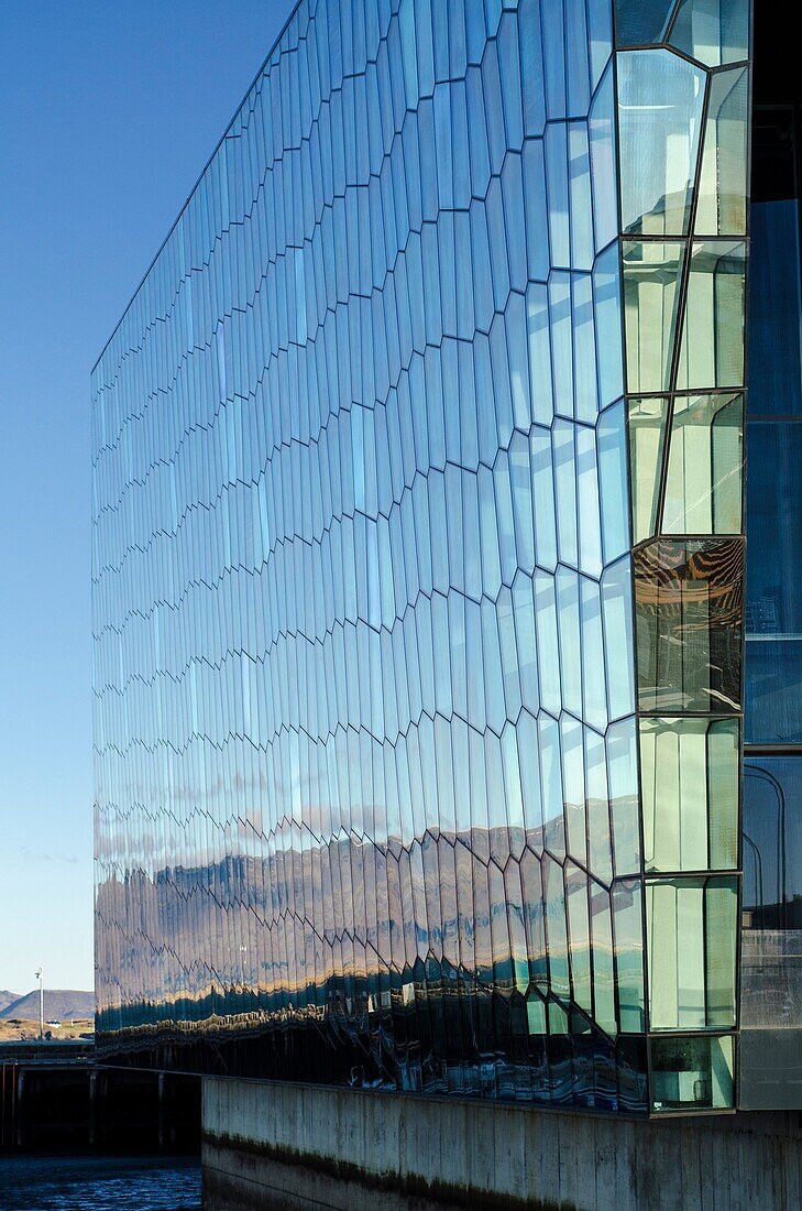 Harpa Concert Hall and Conference centre building designed by Hennin Larsen and Batteríið Architects  It is placed at Reykjavik harbour  Iceland