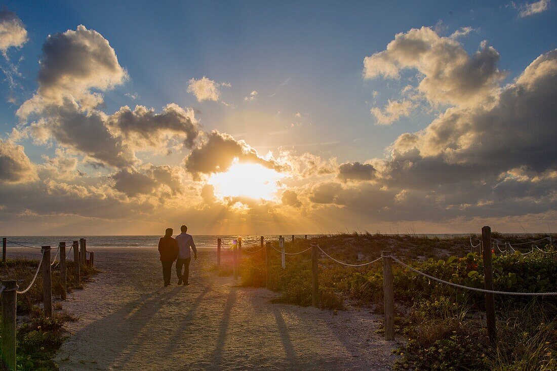 Couple on Venice Beach in Venice Florida at sunset