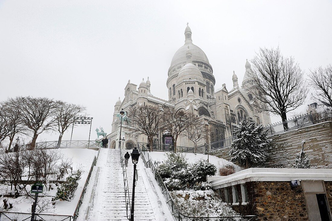 Winter in Paris,the Basilica of Sacre Coeur in Montmartre under the snow,France,Europe