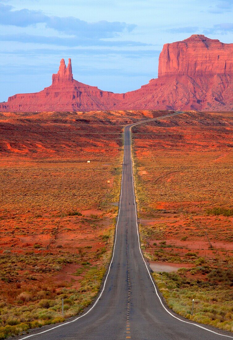 One of the most famous images of the Monument Valley is the long straight road US 163leading across flat desert towards sandstone buttes and pinnacles rock  Monument Valley Tribal Park, Nabajo Nation, Arizona/Utah, USA