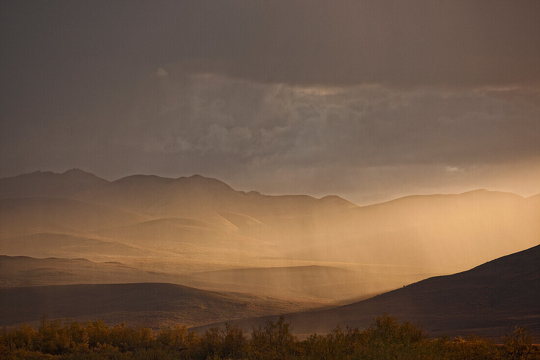 Sunset Light Shining Through Rainfall Along The Dempster Highway, Yukon Canada