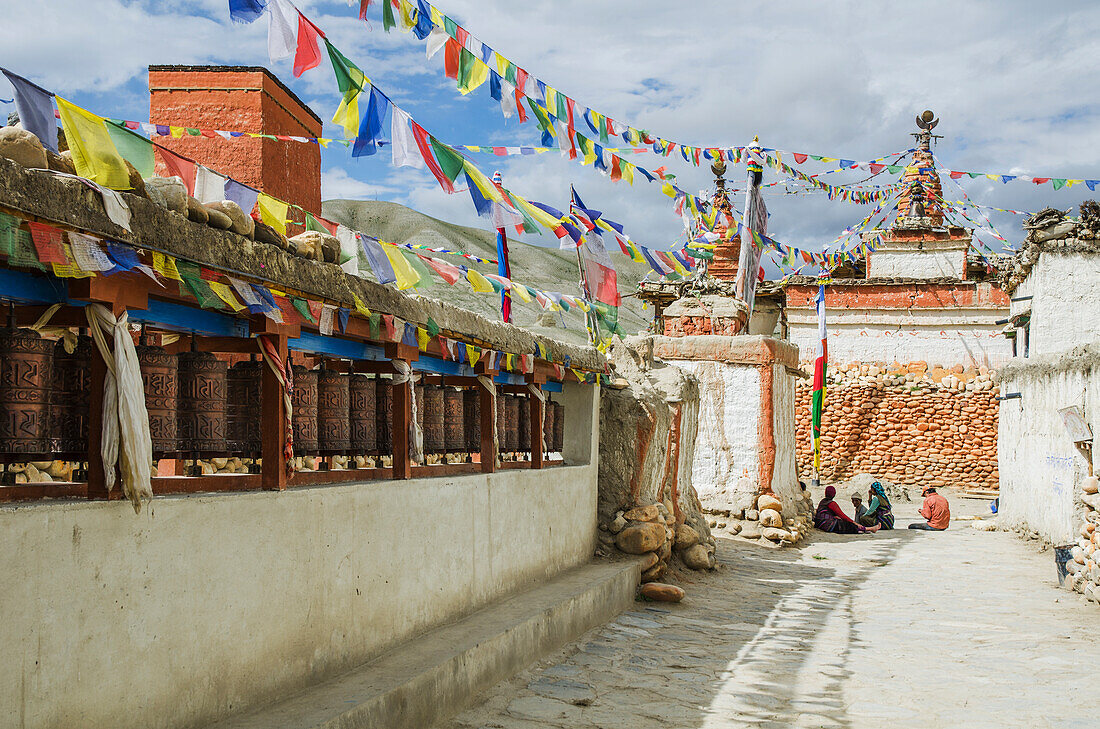 View of stupas, prayer flag and prayer wheels, Lo Manthang, Upper Mustang, Nepal