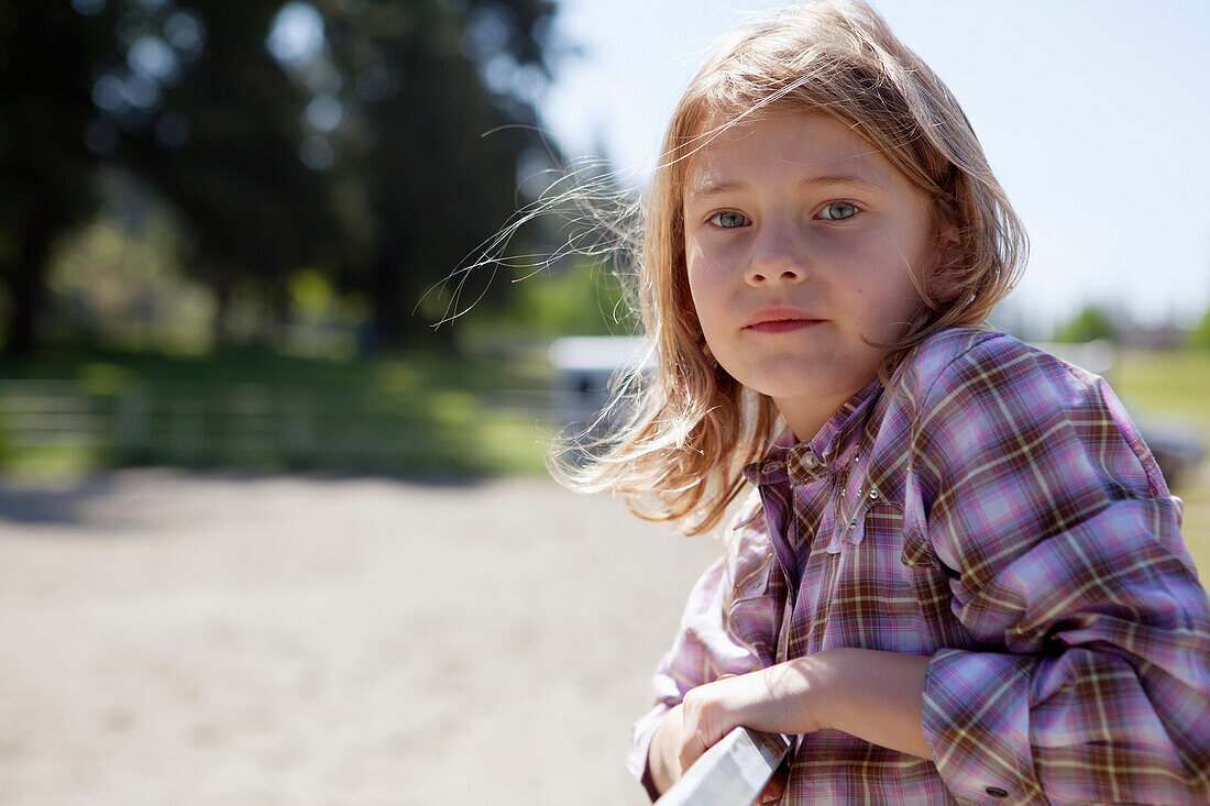 7-year-old girl in plaid shirt outdoors, Langley british columbia canada
