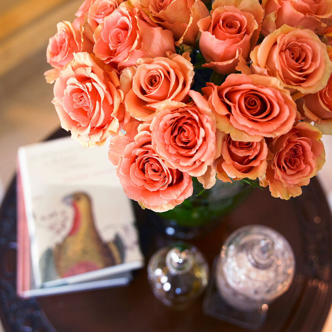 High angle view of orange roses in green vase on side table, Victoria, Vancouver Island, British Columbia, Canada