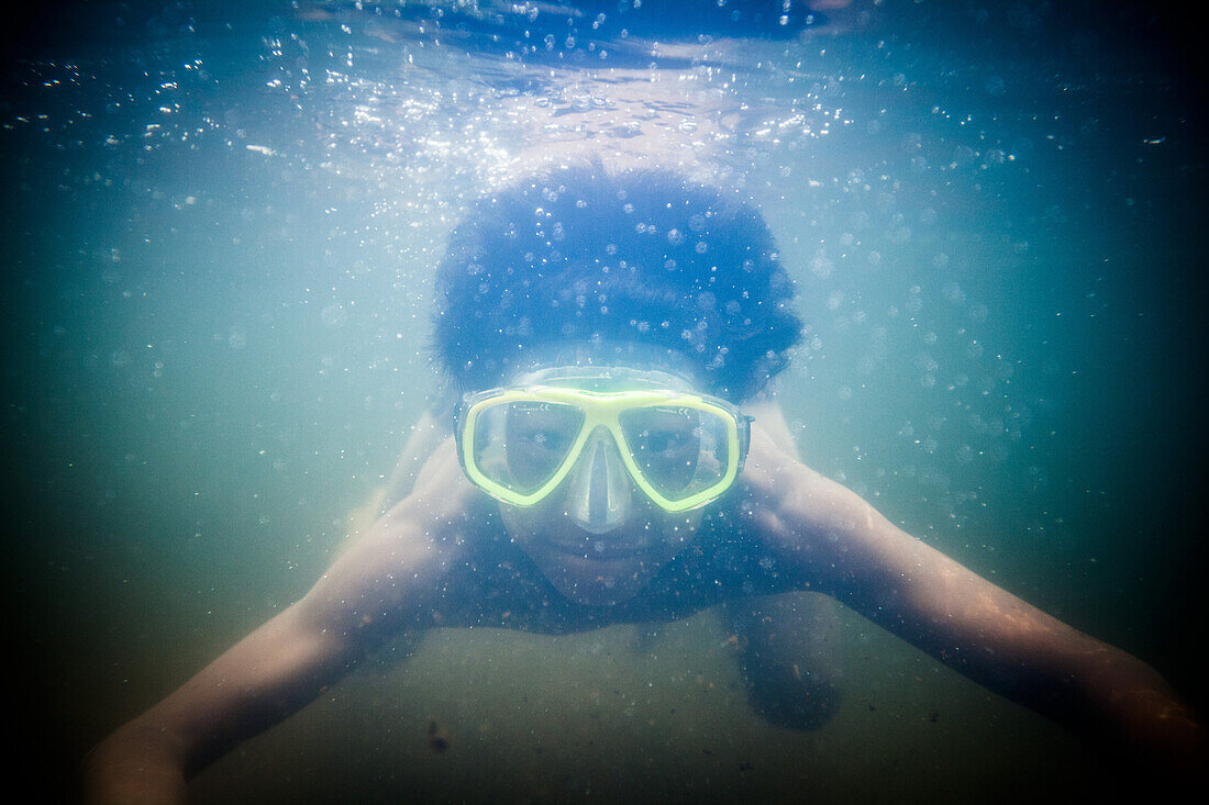Young Boy Wearing Snorkling Mask Underwater