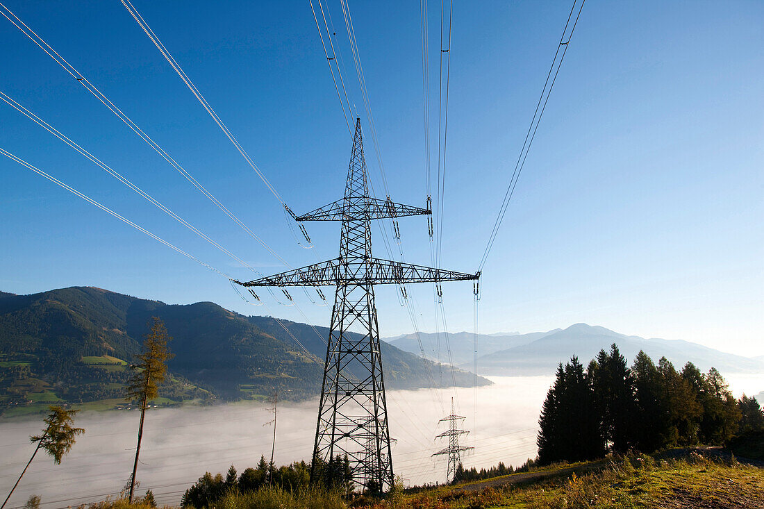Electricity pylons over sea of fog, Kaprun, Salzburg, Austria