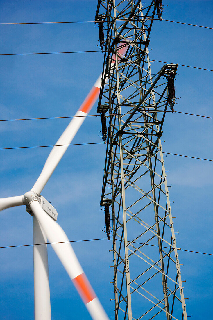 Wind turbine and electricity pylon, Dortmund, North Rhine-Westphalia, Germany
