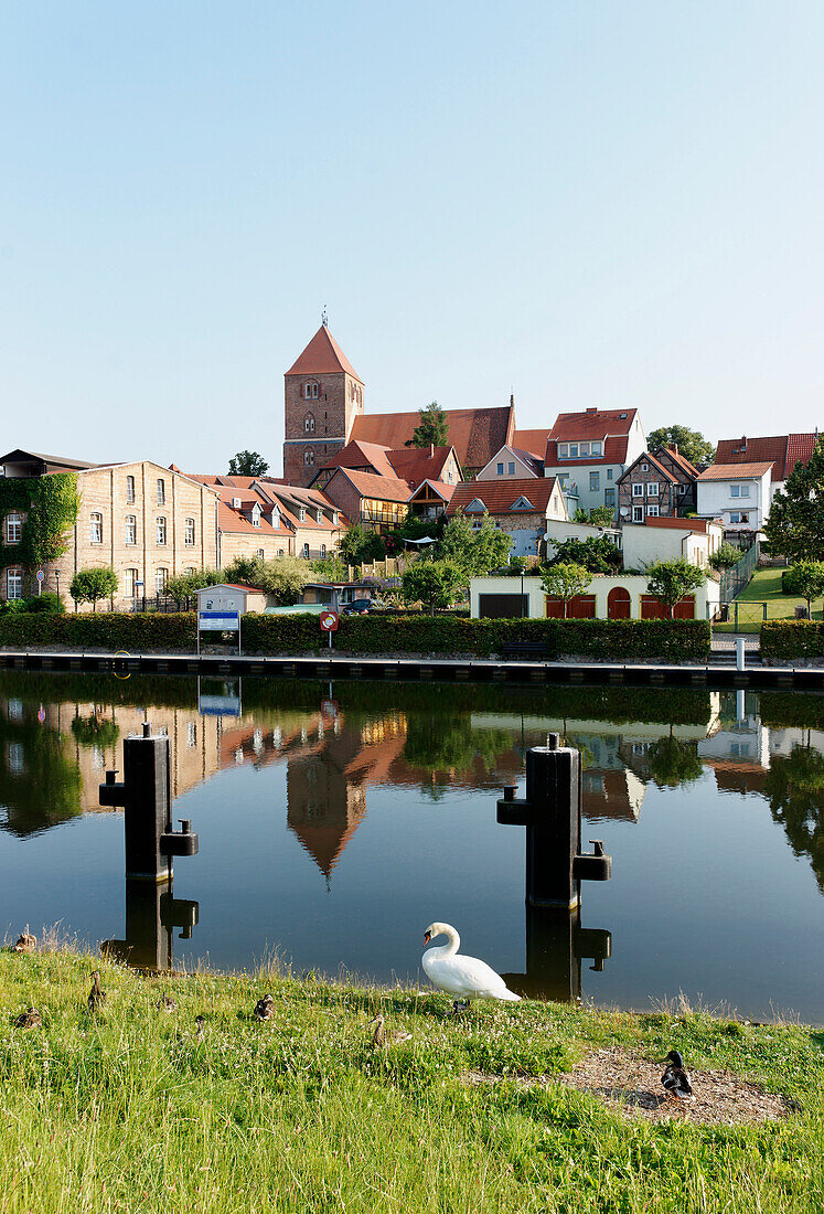 Canal with reflection of St. Mary`s Church, Plau am See, Mecklenburg-Western Pomerania, Germany