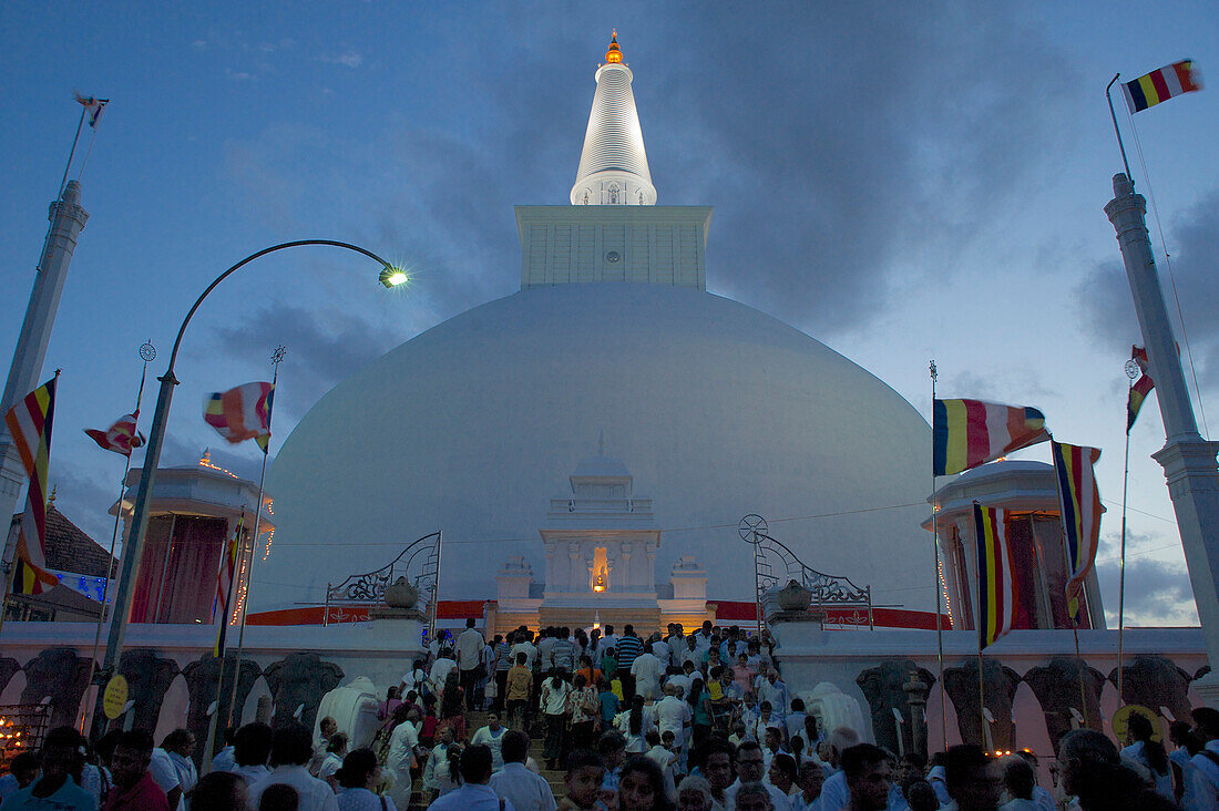 Pilgrims celebrating Poya day at Runaveli Dagoba, Anuradhapura, Cultural Triangel, Sri Lanka