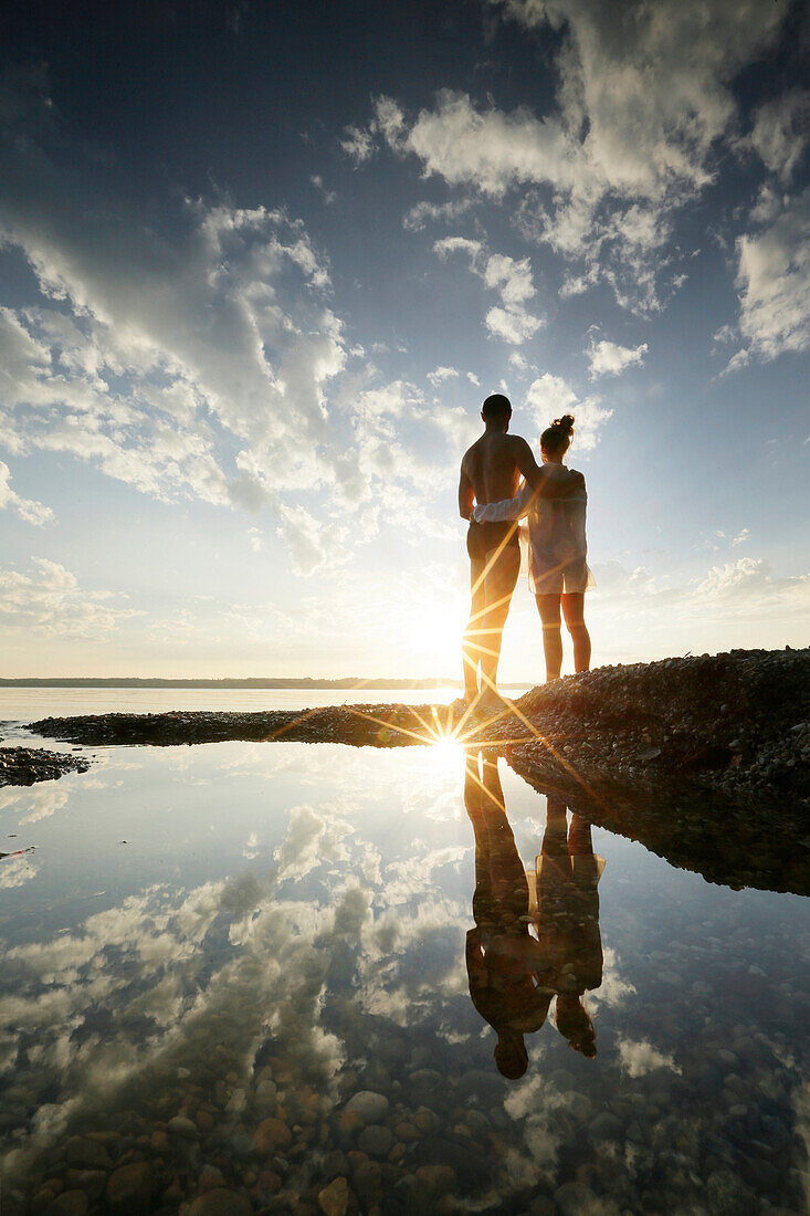 Couple standing at lake Starnberg, Upper Bavaria, Germany