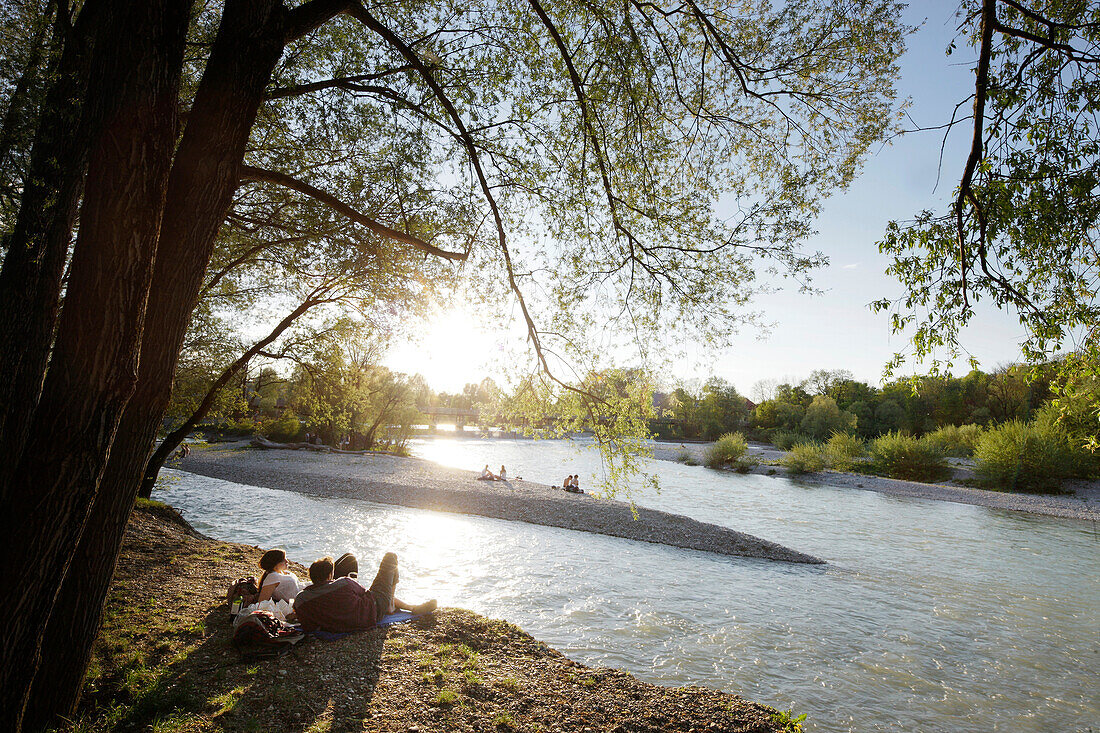 People relaxing at river Isar, Flaucher, Munich, Bavaria, Germany