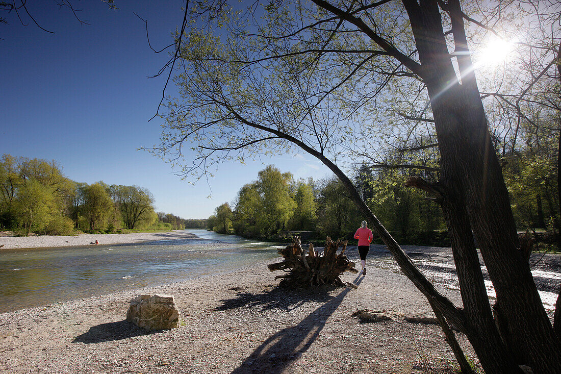 Female jogger, Isar river, Munich, Bavaria, Germany