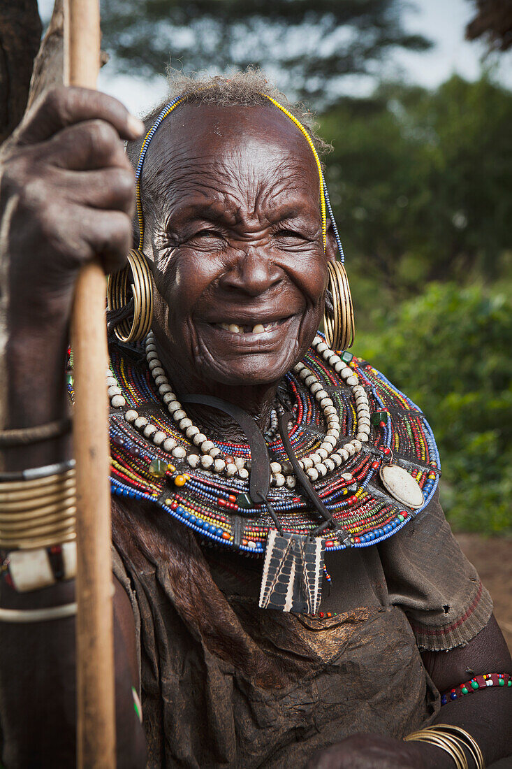 Portrait of traditionally dressed senior woman from Pokot tribe, Lake Baringo, Rift Valley, Kenya
