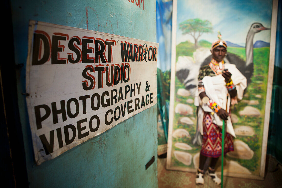 Samburu Moran (young warrior) in traditional dress in photo studio, Kenya