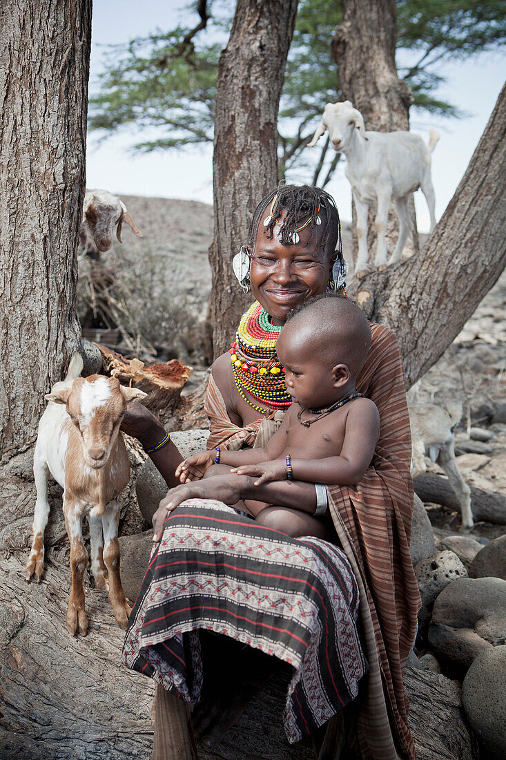 Portrait of traditionally dressed Turkana woman and child, Loyangalani, Kenya