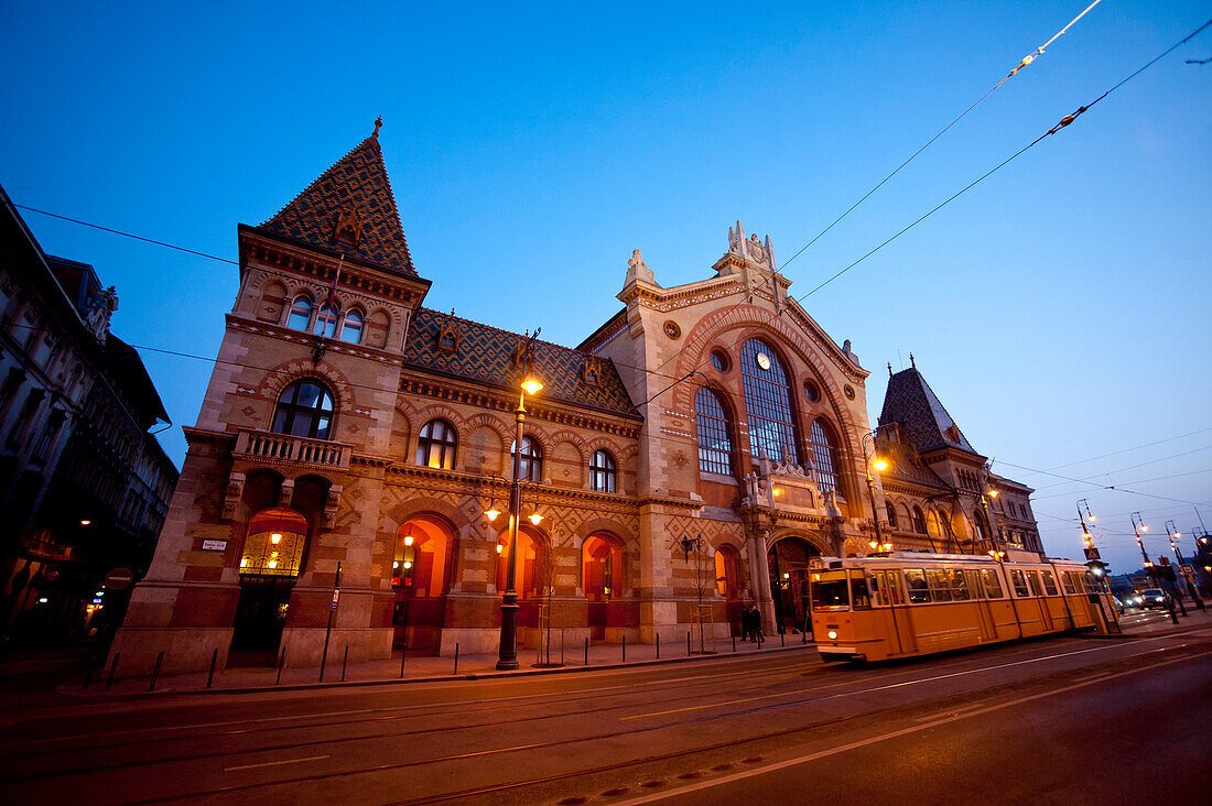 Tram Passing In Front Of Central Market Hall At Night, Budapest, Hungary
