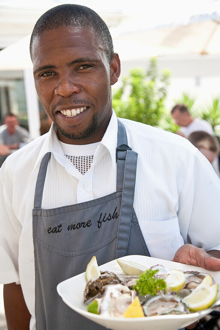 South Africa, Portrait of waiter at Protea Hotel restaurant, Mossel Bay