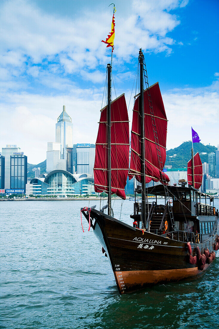 Traditional Chinese Junk boat, converted for tourists rides around harbor, Victoria Harbor, Hong Kong Island, China