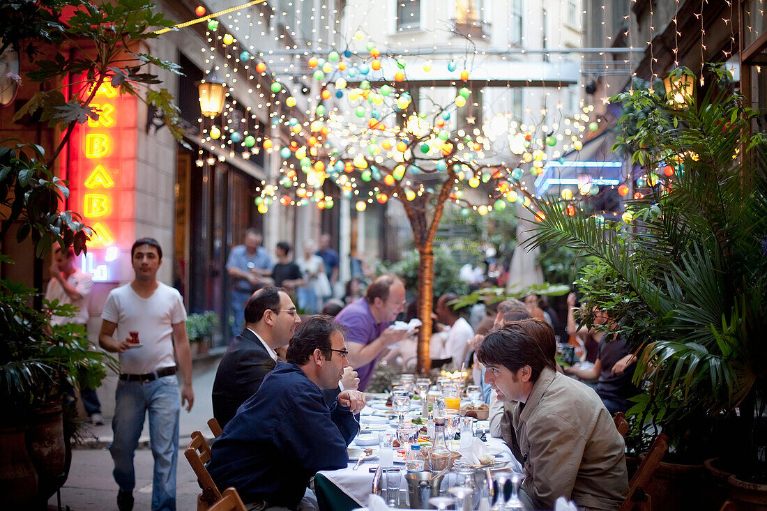 Turkey, Istanbul, People in restaurant at Sofyali Sokak, Beyoglu district