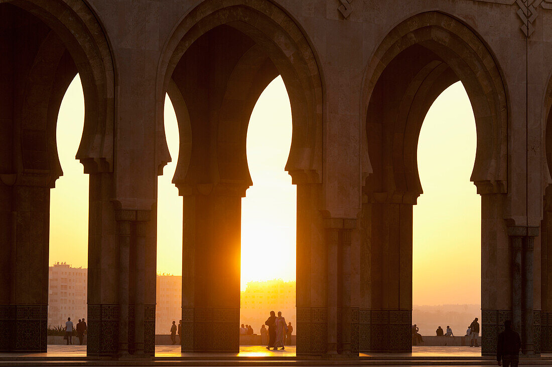 Looking through arches of Hassan II Mosque at dusk, Casablanca, Morocco