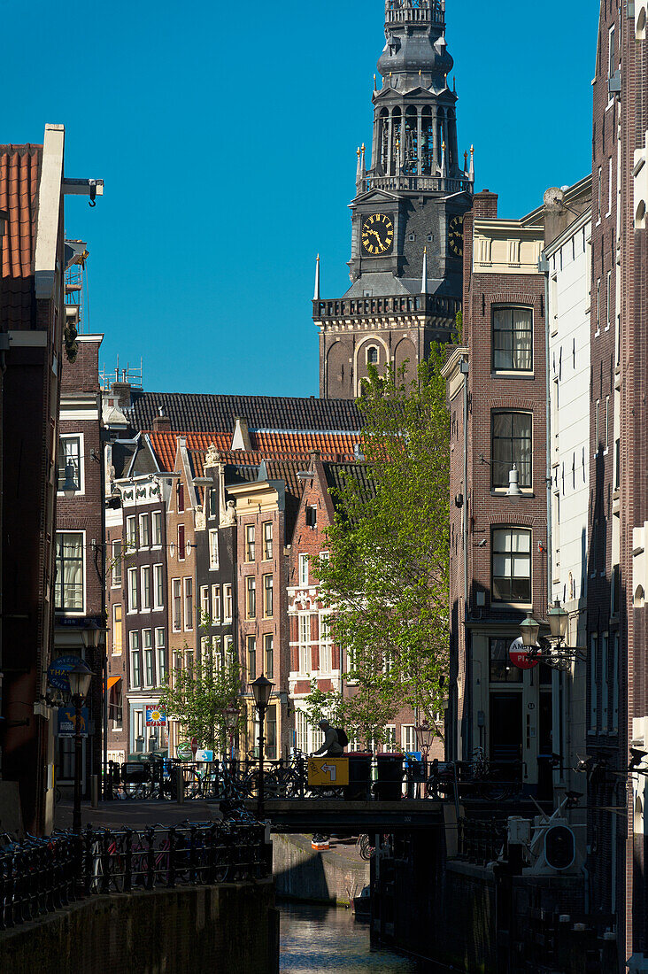 Looking along canal to Oude Kerk Church, Amsterdam, Holland