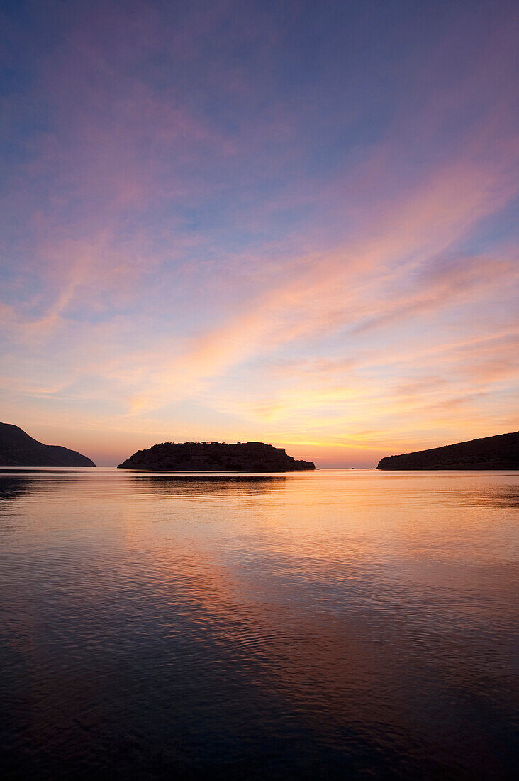 Silhouette of island of Spinalonga at dawn, Crete, Greece