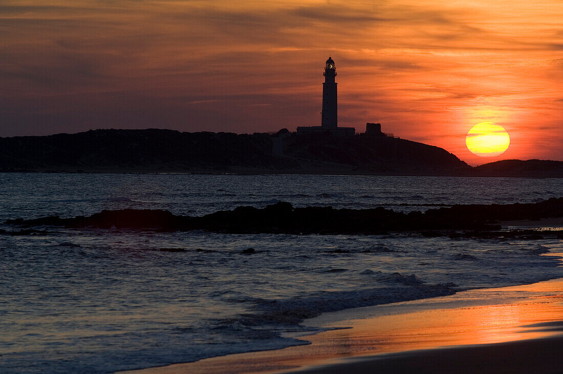 The beaches of the Atlantic Coast of southern Spain - the Costa de La Luz.The lighthouse of Cabo (Cape) Trafalgar at sunset.  Andalucia, Spain  © James Sparshatt / Axiom