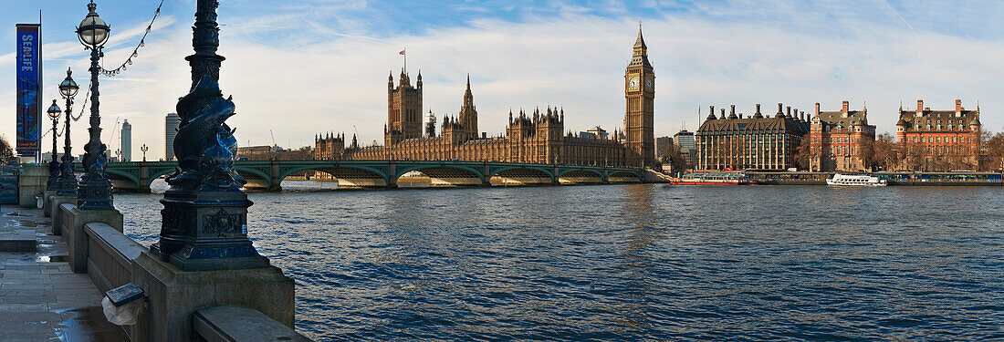 Panoramic view of Houses of Parliament from bank of River Thames, London, UK