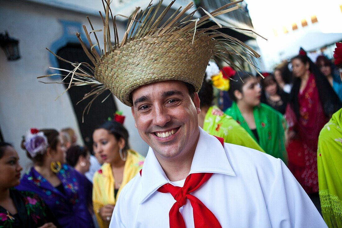 Dressed in traditional clothing people parade through the streets of Old San Juan during the Festival of San Sebastian in San Juan, Puerto Rico