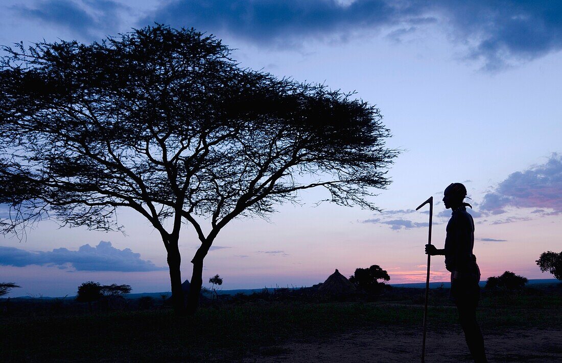 Turmi Ethiopia Africa Lower Omo Valley village sunset twilight Bena tribe silhouette in sky 24