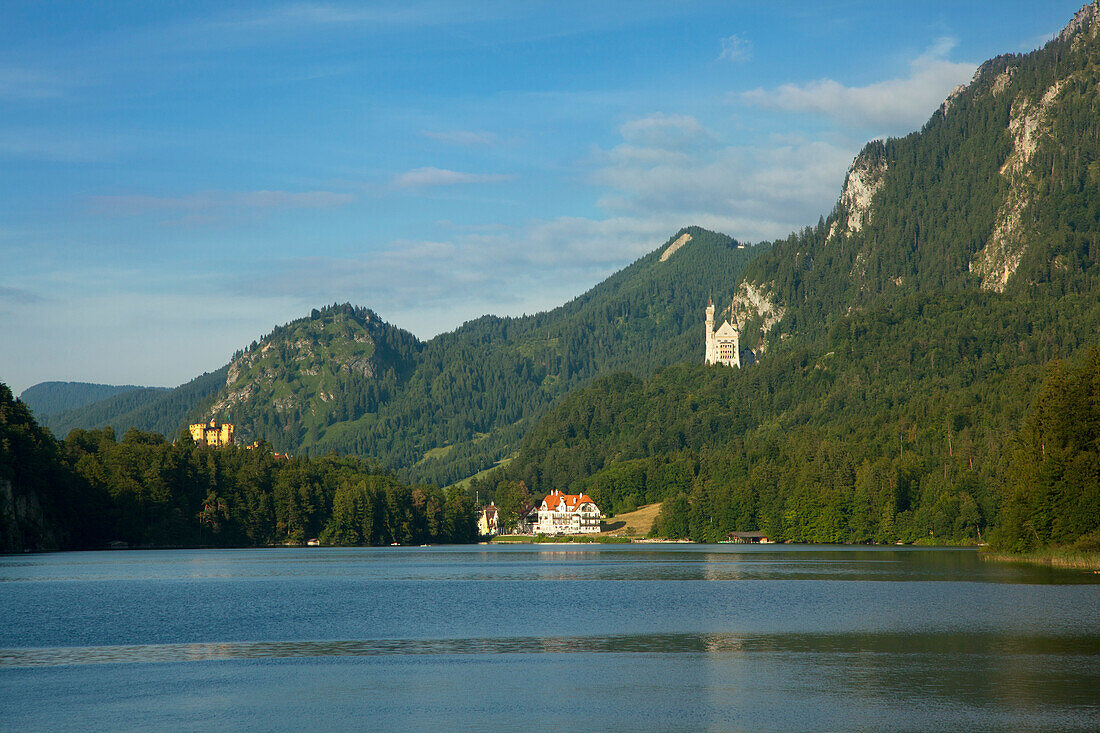 View over Alpsee to Hohenschwangau castle and Neuschwanstein castle, near Hohenschwangau, Fuessen, Allgaeu, Bavaria, Germany