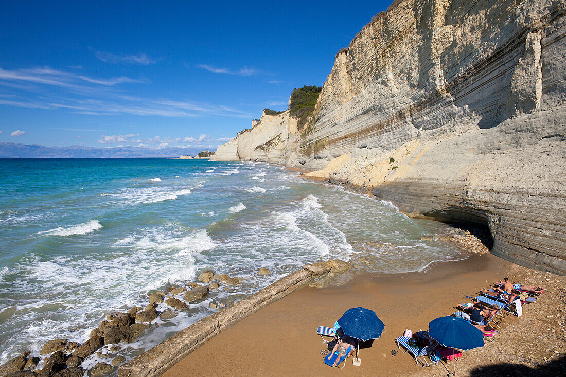 Logas beach, Sunset beach at the rocky coast at Cape Drastis, near Peroulades, Sidari, Corfu island, Ionian islands, Greece