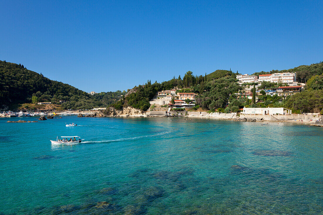 Excursion boat at Alipa Bay, Paleokastritsa, Corfu island, Ionian islands, Greece