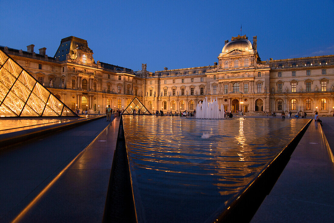 Louvre and pyramid at night, Paris, France, Europe