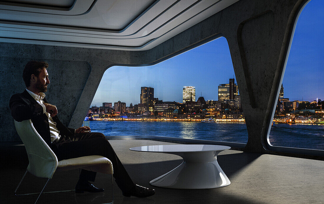 Mann sitz in einer modernen virtuellen Wohnung und schaut auf die Hafenskyline, Hamburg, Deutschland